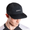 Gorra de malla negra con el logotipo 'Zone3', llevada por una persona, sobre fondo blanco